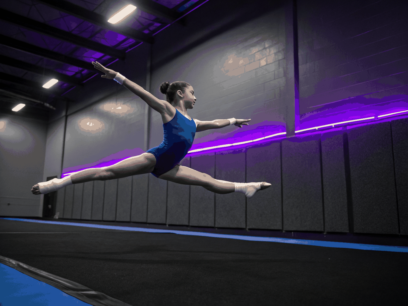 Young gymnast practicing balance on a beam